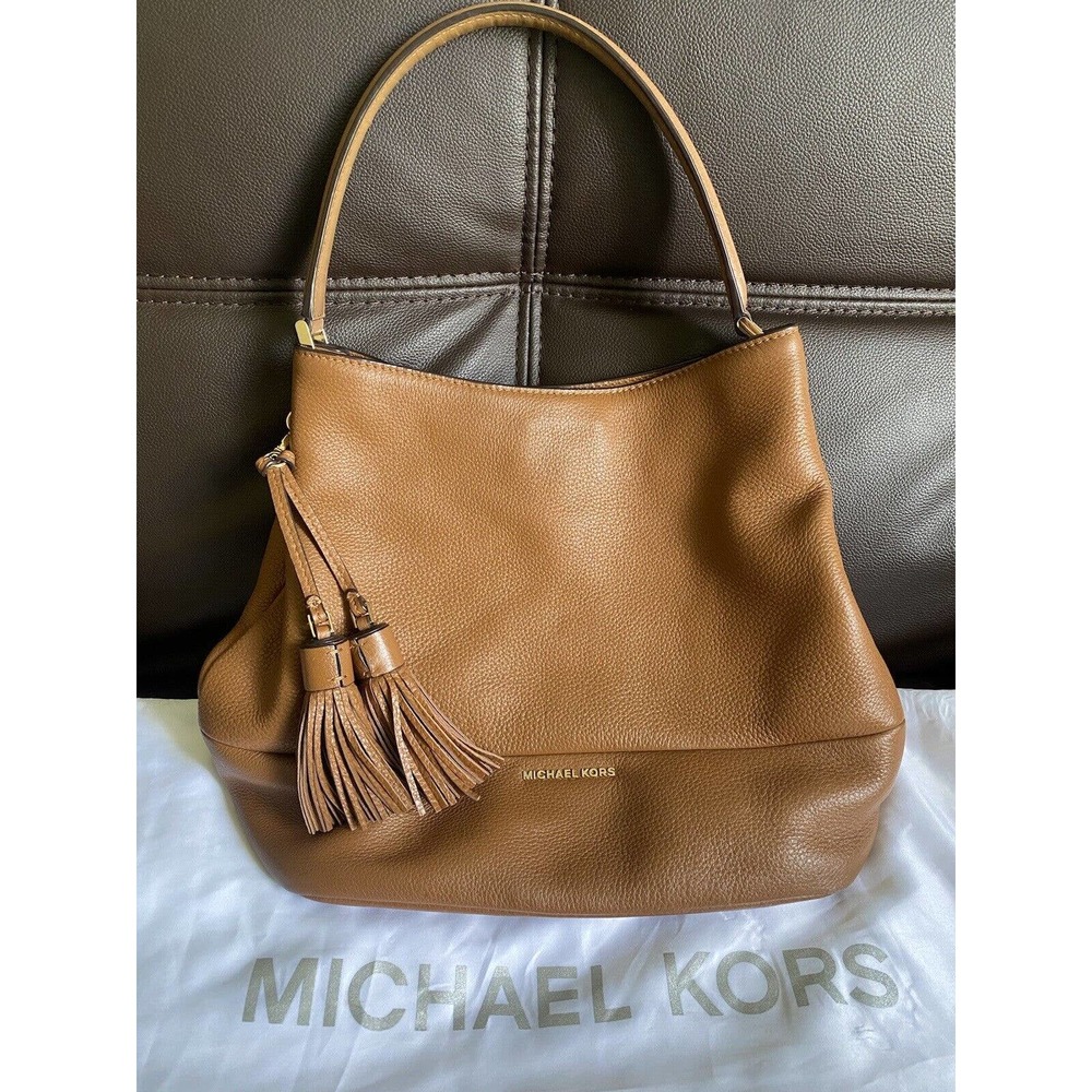 Michael kors brown Peppled leather tassel Shoulder Bag W/ Gold Hardware.